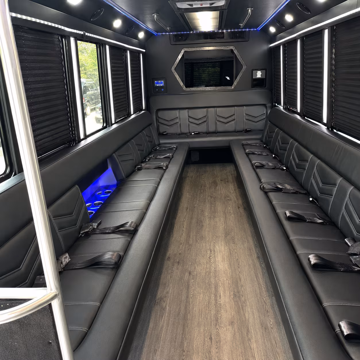 Wedding guests seated inside a party bus serving Cambridge